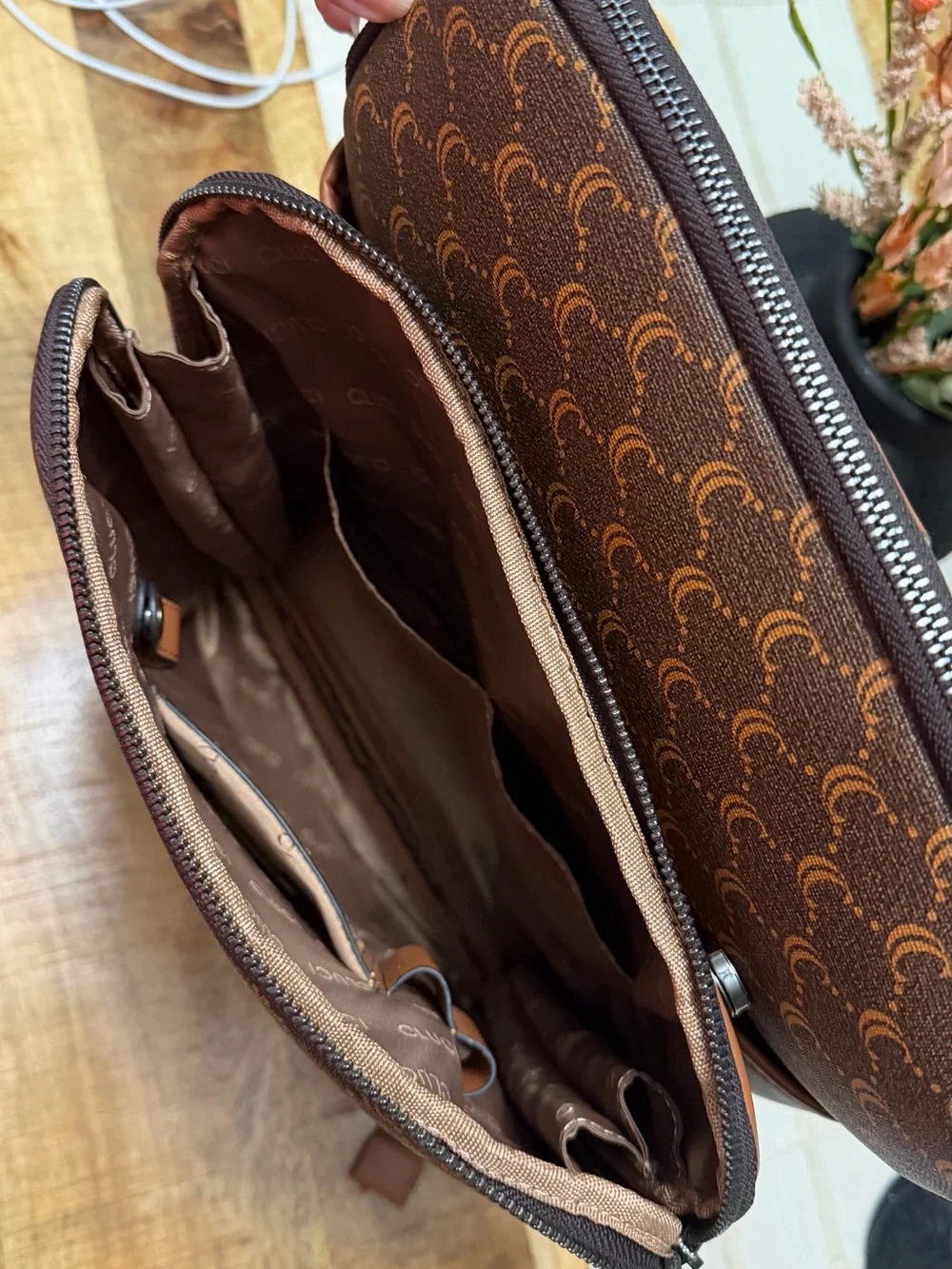 Cluci laptop Backpack with Crescent Pattern and different pockets.